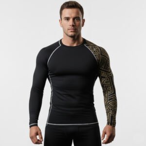 Front view of men’s black and gold tribal rashguard worn by model showing stitching and printing.
